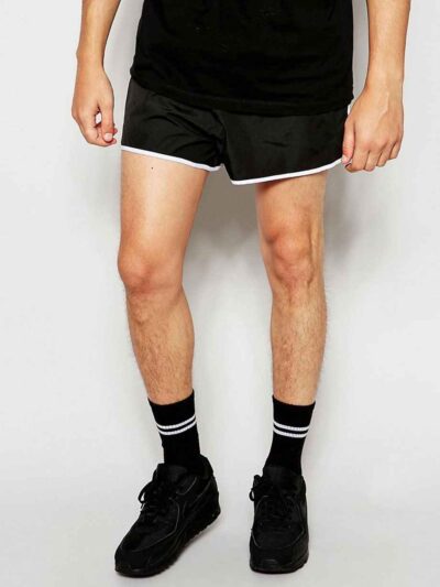 Quick-dry beach shorts: vibrant print, polyester weave detail, sturdy seams. Men's swimwear, customizable with logo. Light bl