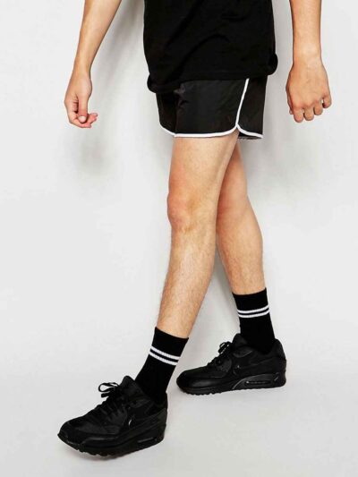 Quick-dry beach shorts: vibrant print, polyester weave detail, sturdy seams. Men's swimwear, customizable with logo. Light bl