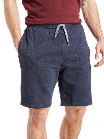 Close-up: Textured swim trunks. Quick-dry fabric, subtle print detail. Board shorts with reinforced stitching & adjustable dr