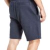 Close-up: Textured swim trunks. Quick-dry fabric, subtle print detail. Board shorts with reinforced stitching & adjustable dr