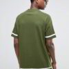 Close-up of custom printed shirts. Soft knit fabric, vibrant design. Notice the clean stitching on the short sleeves. A hint