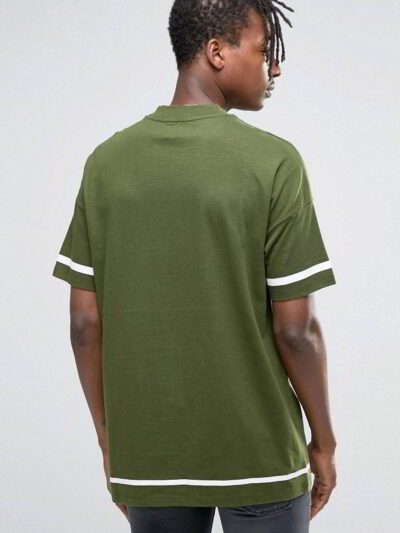Close-up of custom printed shirts. Soft knit fabric, vibrant design. Notice the clean stitching on the short sleeves. A hint