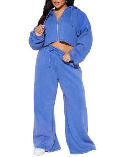 Women's tracksuit set: hooded zip jacket and jogger pants. Soft, textured fabric, clean stitching. Subtle color variations vi