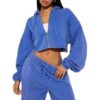 Women's tracksuit set: hooded zip jacket and jogger pants. Soft, textured fabric, clean stitching. Subtle color variations vi