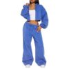 Women's tracksuit set: hooded zip jacket and jogger pants. Soft, textured fabric, clean stitching. Subtle color variations vi