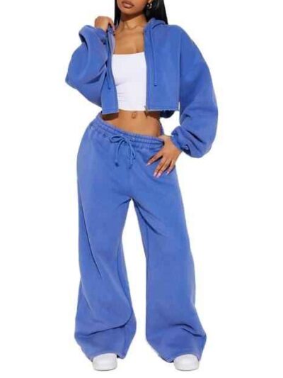 Women's tracksuit set: hooded zip jacket and jogger pants. Soft, textured fabric, clean stitching. Subtle color variations vi