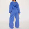 Women's tracksuit set: hooded zip jacket and jogger pants. Soft, textured fabric, clean stitching. Subtle color variations vi