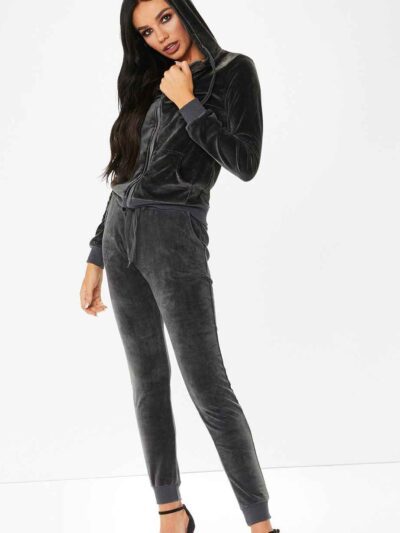 Slim fit grey velour tracksuit. Soft texture visible. Note customized logo printing, subtle stitching detail. Comfortable lou
