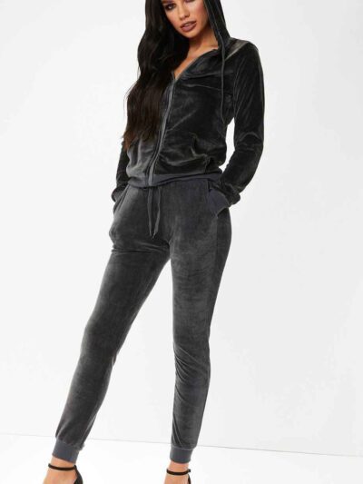 Slim fit grey velour tracksuit. Soft texture visible. Note customized logo printing, subtle stitching detail. Comfortable lou