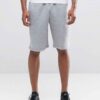 Durable polyester sports shorts in vibrant color; close-up shows reinforced stitching and breathable fabric texture. Ideal sc