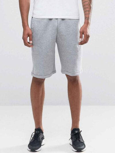 Durable polyester sports shorts in vibrant color; close-up shows reinforced stitching and breathable fabric texture. Ideal sc