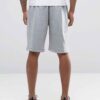 Durable polyester sports shorts in vibrant color; close-up shows reinforced stitching and breathable fabric texture. Ideal sc