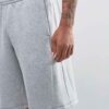 Durable polyester sports shorts in vibrant color; close-up shows reinforced stitching and breathable fabric texture. Ideal sc