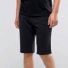 Summer jogger shorts in a light, breathable fabric. Note the elastic waistband, drawstring, and clean stitching. Perfect for