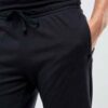 Summer jogger shorts in a light, breathable fabric. Note the elastic waistband, drawstring, and clean stitching. Perfect for
