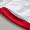 Close-up elastic waist workout shorts, subtle textured fabric, neat stitching detail. Garment type: women's running shorts. C
