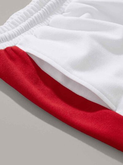 Close-up elastic waist workout shorts, subtle textured fabric, neat stitching detail. Garment type: women's running shorts. C