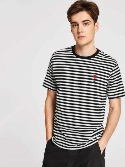 Close-up of a substantial, dark grey t-shirt. Notice the dense knit, reinforcing stitching around the collar and sleeves, hin