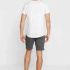 Men's lightweight cotton short set, ideal for summer. Soft textured fabric, precise stitching. Casual two-piece, light color,