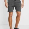 Men's lightweight cotton short set, ideal for summer. Soft textured fabric, precise stitching. Casual two-piece, light color,