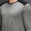Heathered grey long sleeve t-shirt, soft texture, clean stitching. Classic crew neck style, ideal for layering. Unisex fit. -