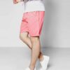 Close-up of vibrant running shorts. High-stretch spandex, fine stitching details. Athletic apparel in bright hues, ideal for
