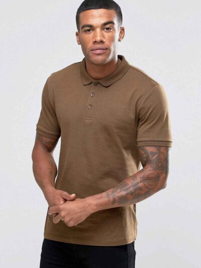 Close-up of a textured polo shirt. Fine pique knit, reinforced stitching, vibrant color hints. Customizable with your logo. -