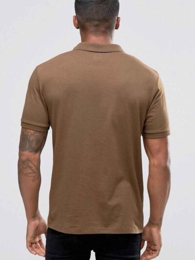 Close-up of a textured polo shirt. Fine pique knit, reinforced stitching, vibrant color hints. Customizable with your logo. -