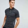 Close-up polo shirt. High-quality knit fabric, detailed embroidery. Navy blue & white, textured look. Short-sleeved, premium