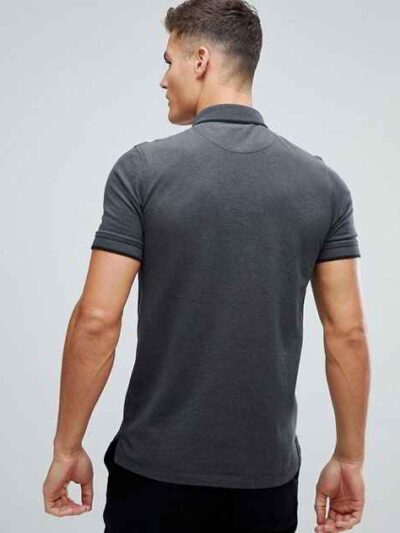 Close-up polo shirt. High-quality knit fabric, detailed embroidery. Navy blue & white, textured look. Short-sleeved, premium