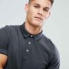 Close-up polo shirt. High-quality knit fabric, detailed embroidery. Navy blue & white, textured look. Short-sleeved, premium