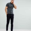Close-up polo shirt. High-quality knit fabric, detailed embroidery. Navy blue & white, textured look. Short-sleeved, premium
