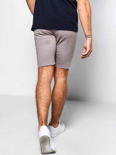 Close-up of athletic shorts. Smooth, flexible fabric, reinforced stitching. Deep black with subtle reflective accents. Workou