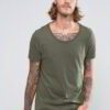 Close-up: Printed cotton t-shirt, breathable knit. Detailed stitching, vibrant design. Soft, comfortable wholesale tees in bu