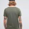 Close-up: Printed cotton t-shirt, breathable knit. Detailed stitching, vibrant design. Soft, comfortable wholesale tees in bu
