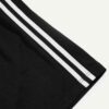 Close-up of athletic shorts. Breathable knit fabric, strong stitching, vibrant color. Ideal gym or team wear. Moisture-wickin
