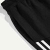 Close-up of athletic shorts. Breathable knit fabric, strong stitching, vibrant color. Ideal gym or team wear. Moisture-wickin