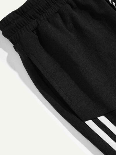 Close-up of athletic shorts. Breathable knit fabric, strong stitching, vibrant color. Ideal gym or team wear. Moisture-wickin