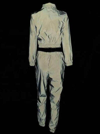Reflective tracksuit set: shimmering silver accents on durable black fabric. Visible zipper tracks, tailored fit, quality sti