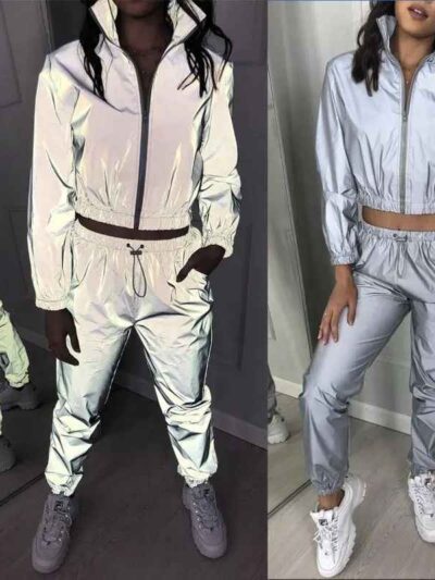 Reflective tracksuit set: shimmering silver accents on durable black fabric. Visible zipper tracks, tailored fit, quality sti