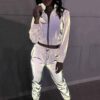 Reflective tracksuit set: shimmering silver accents on durable black fabric. Visible zipper tracks, tailored fit, quality sti
