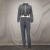 Reflective tracksuit set: shimmering silver accents on durable black fabric. Visible zipper tracks, tailored fit, quality sti