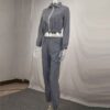 Reflective tracksuit set: shimmering silver accents on durable black fabric. Visible zipper tracks, tailored fit, quality sti