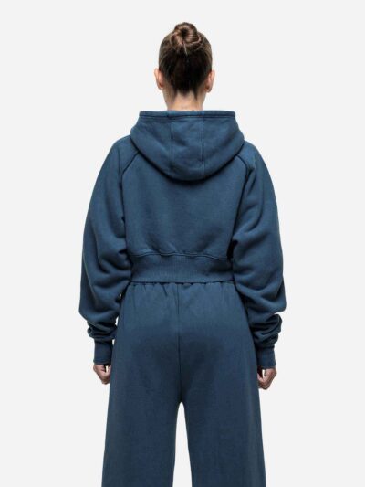 Women's running tracksuit set. Peach-toned heathered fabric, flatlock seams, fitted silhouette. Activewear for gym or outdoor