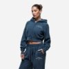 Women's running tracksuit set. Peach-toned heathered fabric, flatlock seams, fitted silhouette. Activewear for gym or outdoor