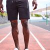 Close-up of premium training shorts: smooth, solid color fabric, reinforced stitching. Athletic wear for intense workouts. -