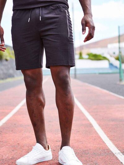 Close-up of premium training shorts: smooth, solid color fabric, reinforced stitching. Athletic wear for intense workouts. -