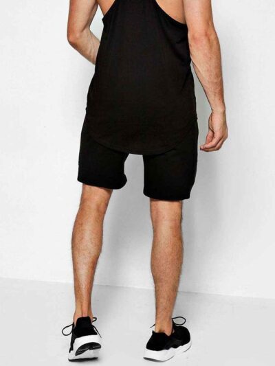 Close-up of premium training shorts: smooth, solid color fabric, reinforced stitching. Athletic wear for intense workouts. -