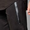 Close-up of premium training shorts: smooth, solid color fabric, reinforced stitching. Athletic wear for intense workouts. -