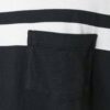 Close-up of bulk blank t-shirts. Smooth cotton blend, neat double-needle stitching. Ready for custom text printing. Neutral t